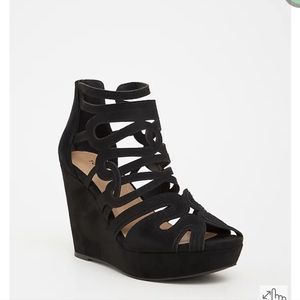 Back zip closure for easy dress4.5" wedgeExtra padded footbed; rubber sole